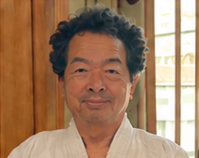 Portrait of Prof. Kunio Yasue in a white training uniform